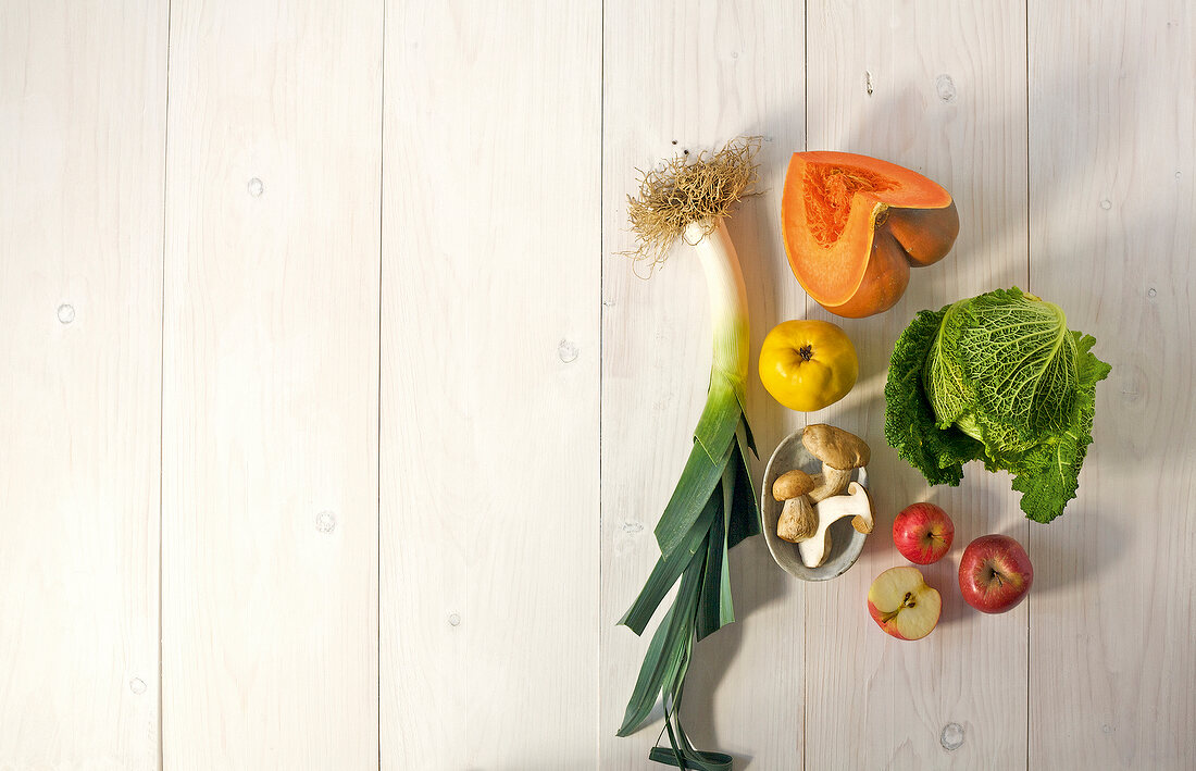 Different types of fruits and vegetables on wooden surface