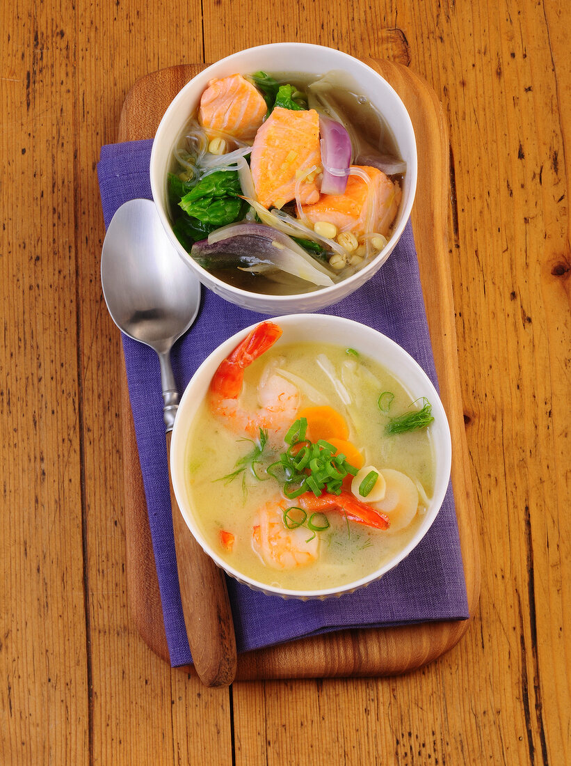 Noodle soup and coconut soup in bowls 