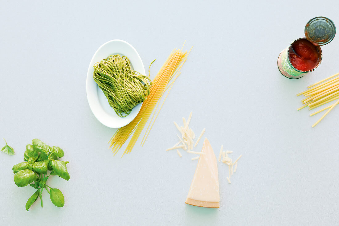 Ingredients for pasta on plate and on white background