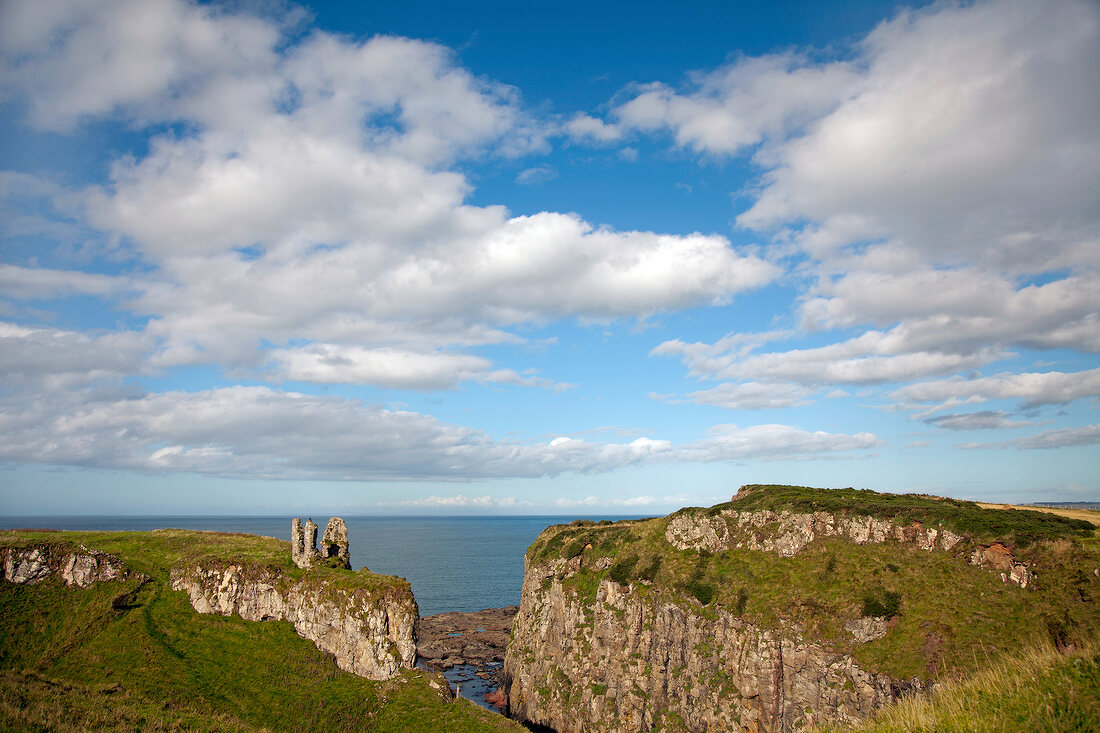 View of Antrim Coast cliffs and Dunseverick Castle, Ireland, UK