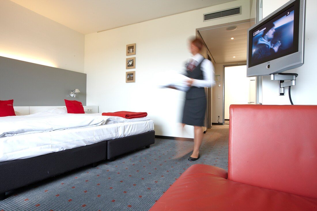 Housekeeper at room in hotel at Vaihingen, Stuttgart, Baden-Wurttemberg, Germany