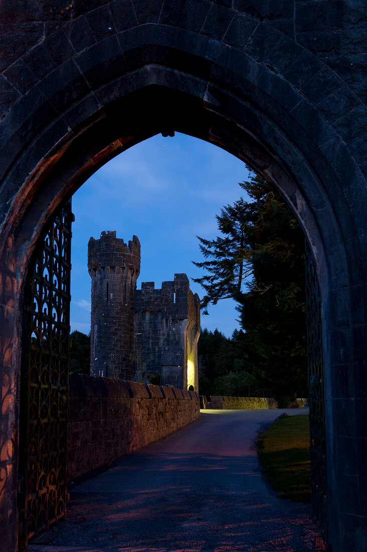 View of Ashford Castle and blue sky at dusk, Ireland, UK