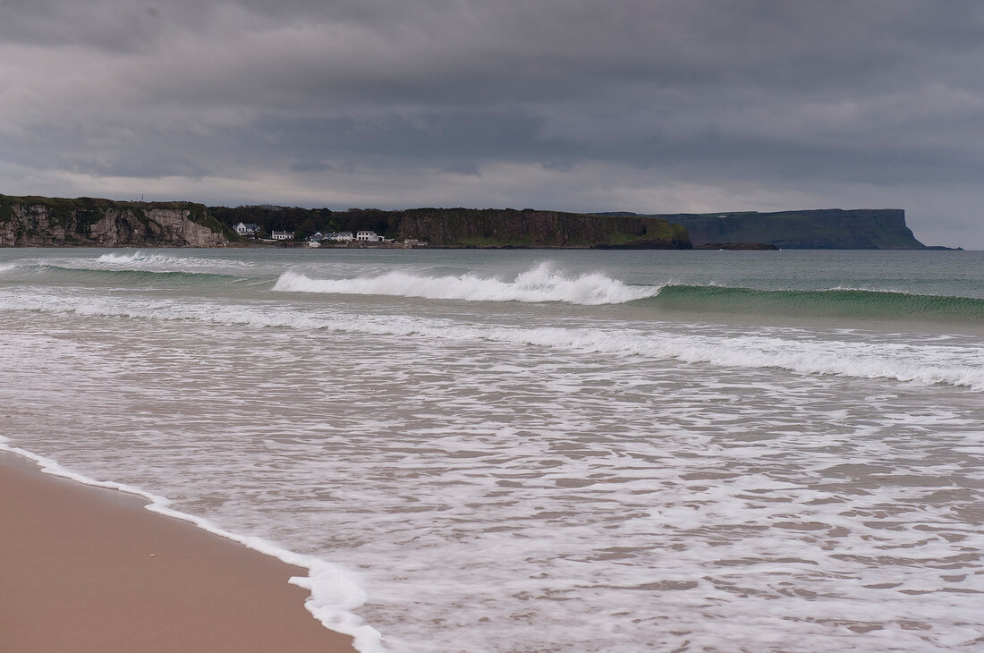 View of Antrim coast beach, sea and cliff in lreland, UK