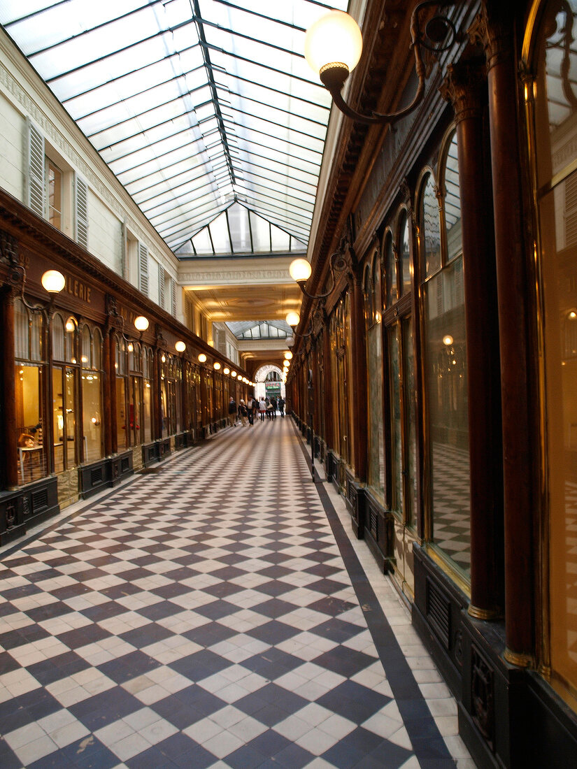 People passing through Gallery Vero Dodat in Paris, France