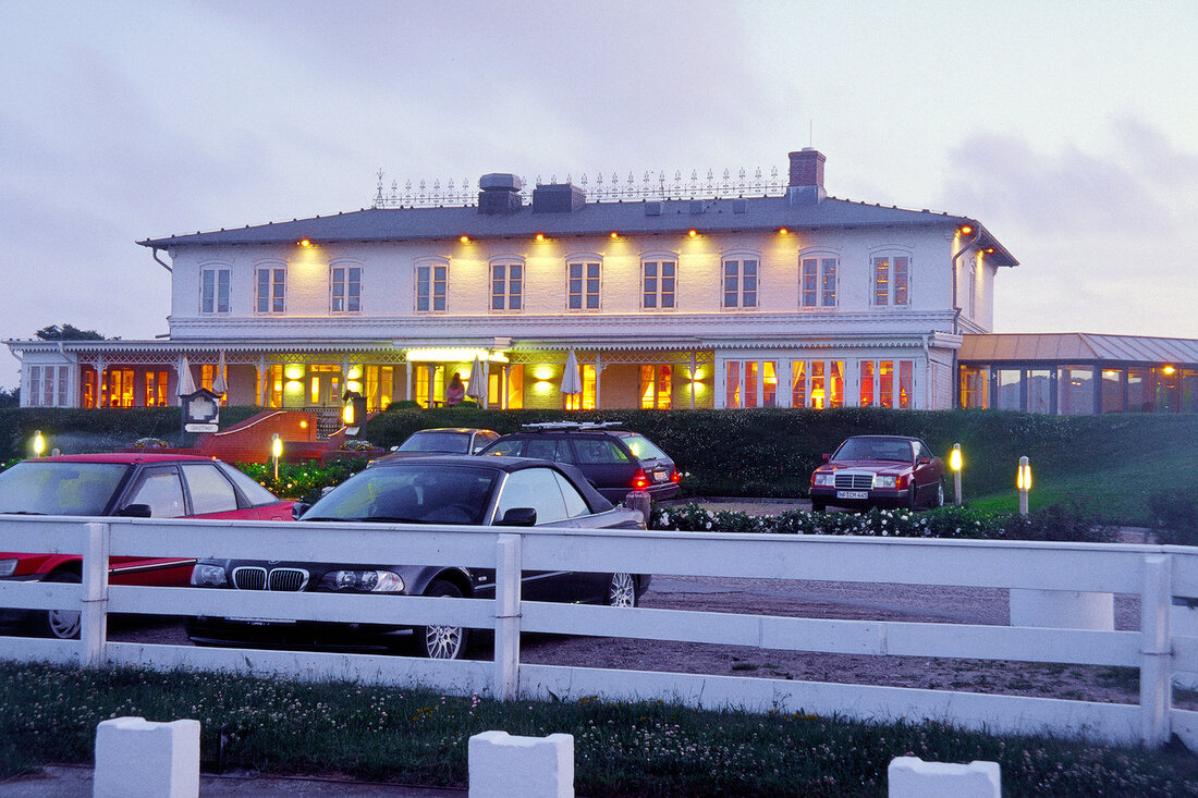 View of illuminated hotel Ferry in Munkmarsch, Sylt, Germany
