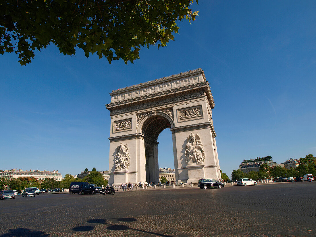 People walking in front of Arc de Triomphe on Place Charles de Gaulle in Paris, France