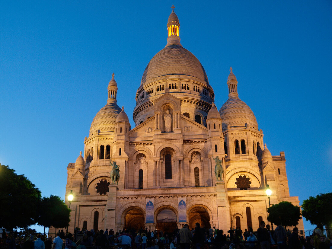 View of the Sacre Coeur at dusk in Paris, France