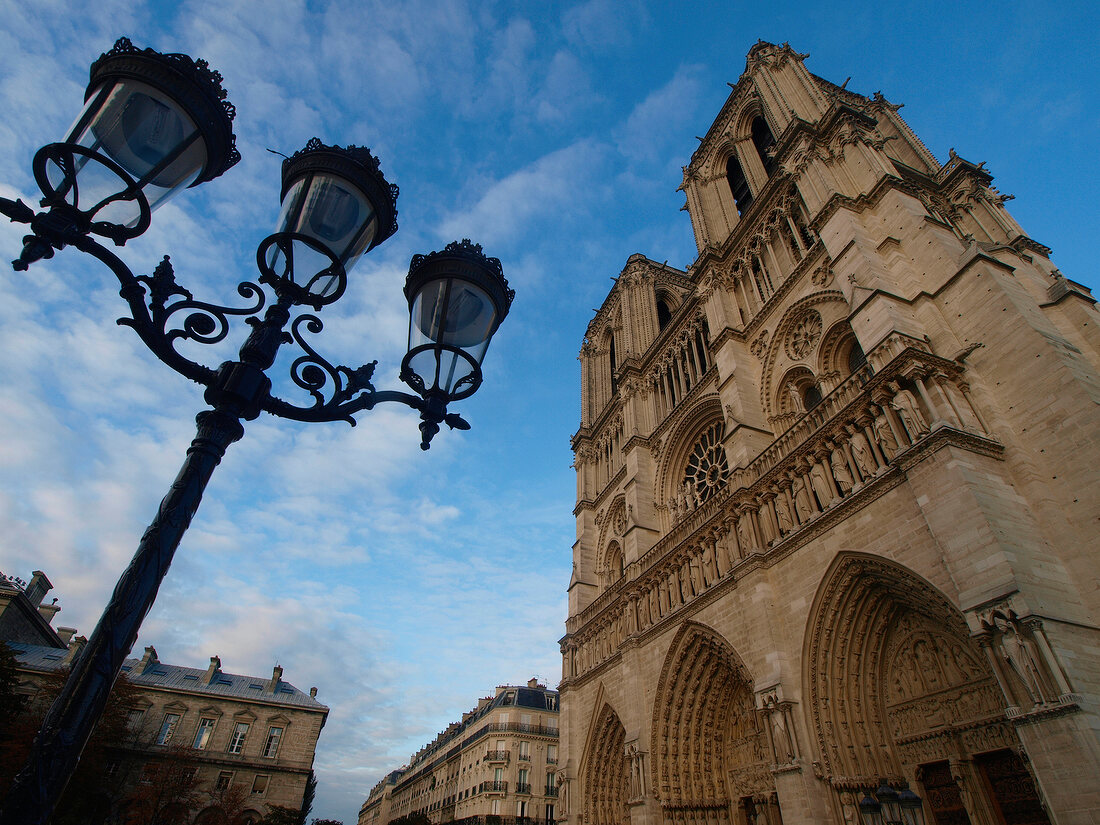 Low angle view of facade of Notre Dame cathedral in Paris, France