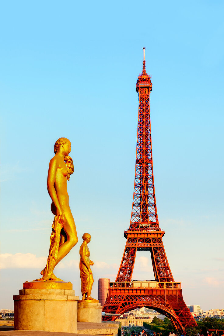 Eiffel Tower and golden statues in Paris, France