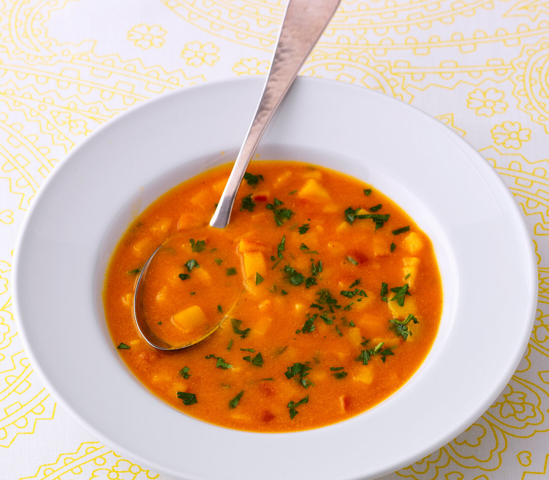 Exotic carrot soup in bowl