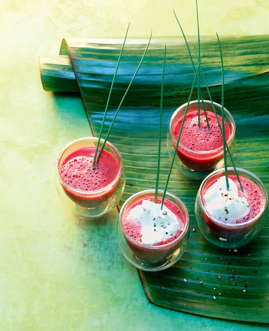 Beetroot cappuccino with vodka and sesame oil in glasses