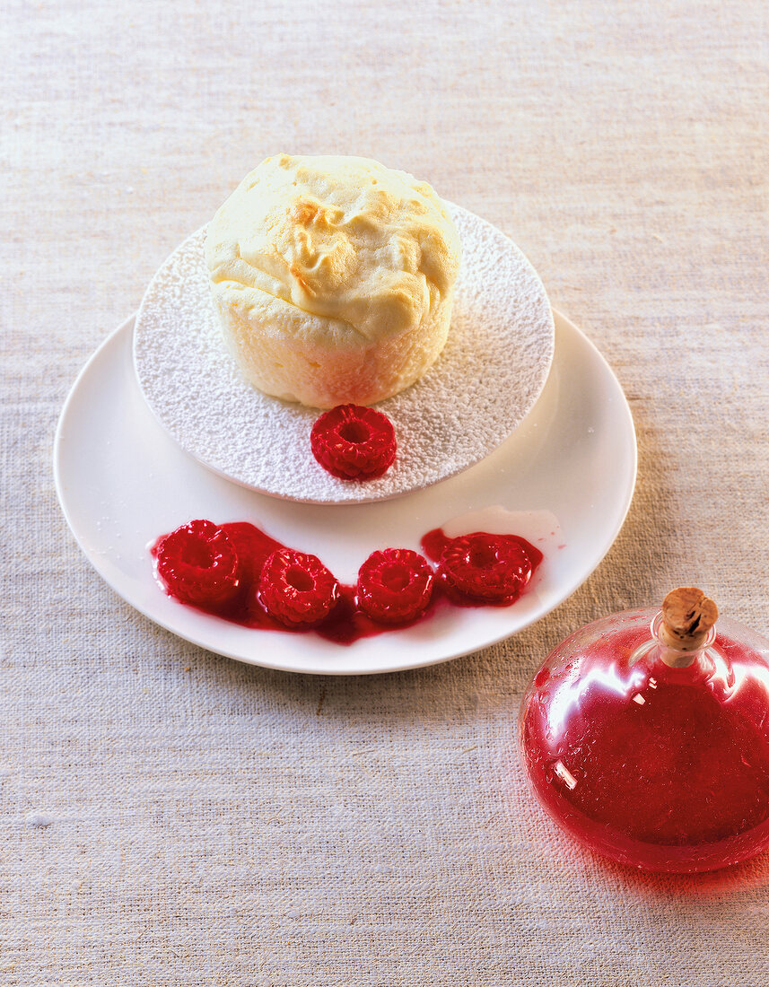 Pot souffle with raspberry oil on plate