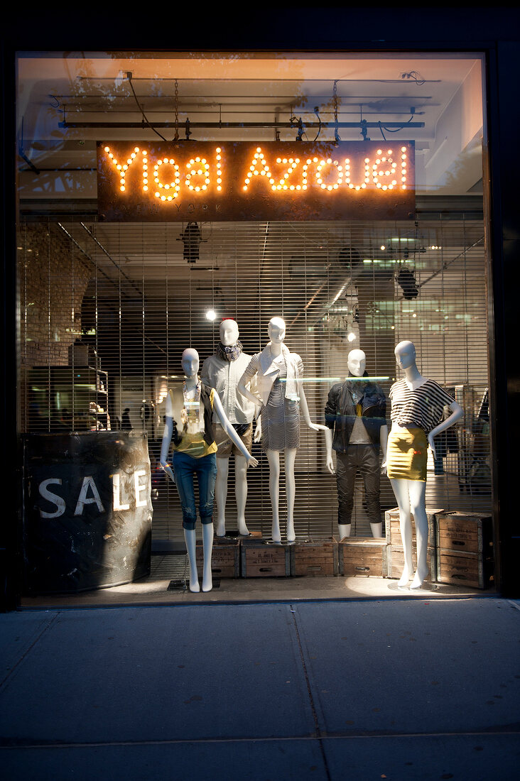 Mannequins with western outfits in window display at Ylgal Azrovel, New York, USA