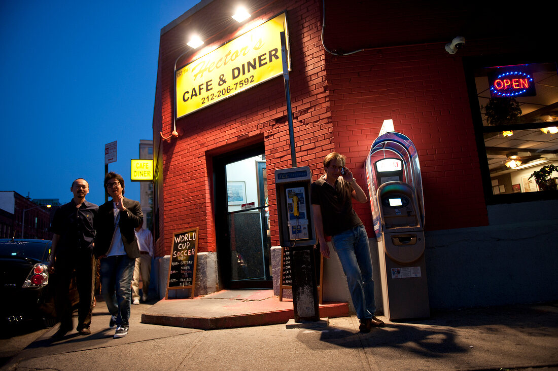 People in front of old cafe and diner in Meat Packing District, New York, USA