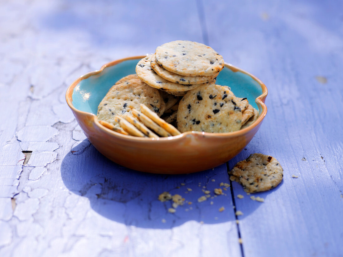 Fiery chilli and olive crackers in serving bowl