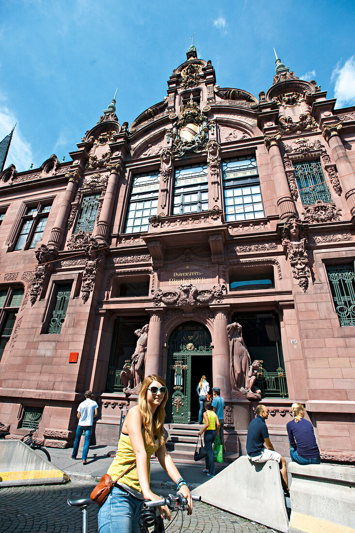 Students standing in front of Ruprecht-Karls-University in Heidelberg, Germany