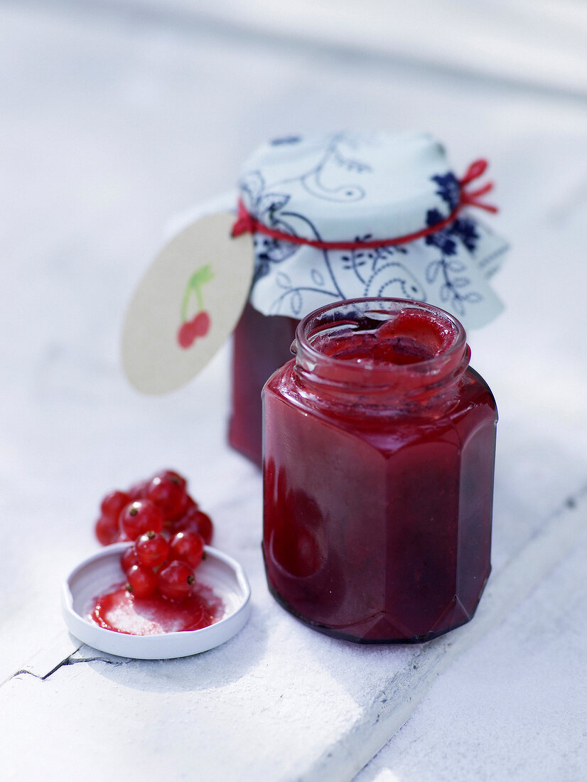 French cherry and redcurrant jam in glass jars
