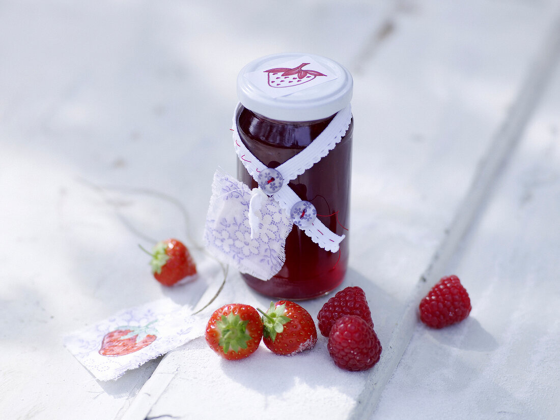 Strawberry and raspberry jelly in glass jar
