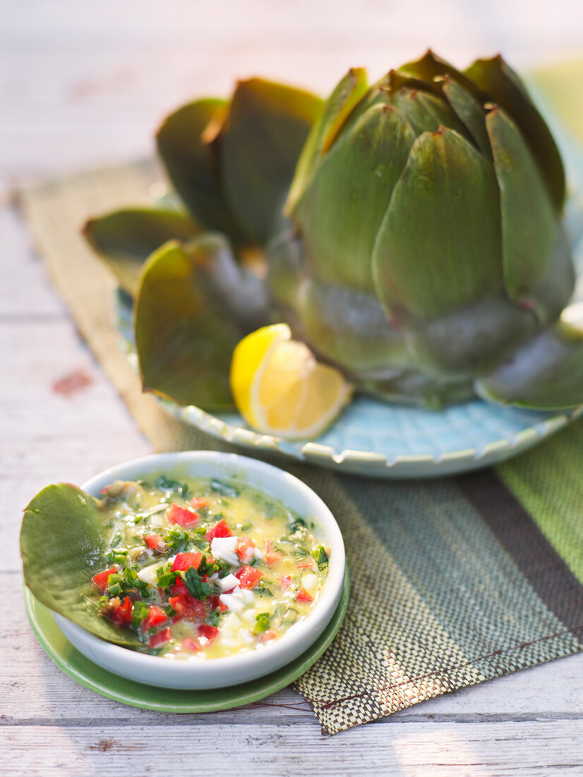 Artichokes with herb and egg vinaigrette on plate