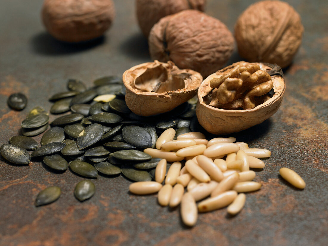 Close-up of walnuts, pine nuts and pumpkin seeds