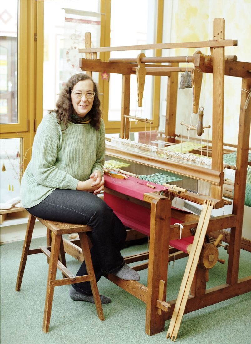 Portrait of weaver Antigone Hochstedt sitting at her loom, Frellstedt, Germany