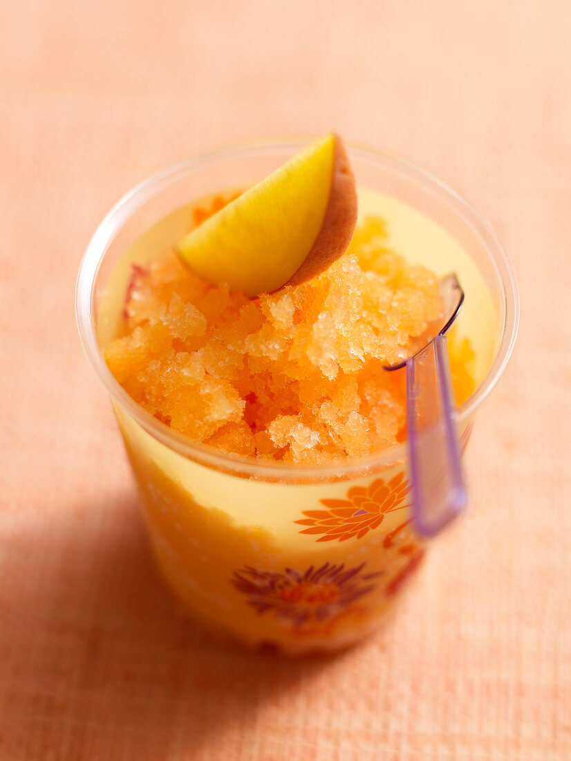 Close-up of peach granita bellini in glass