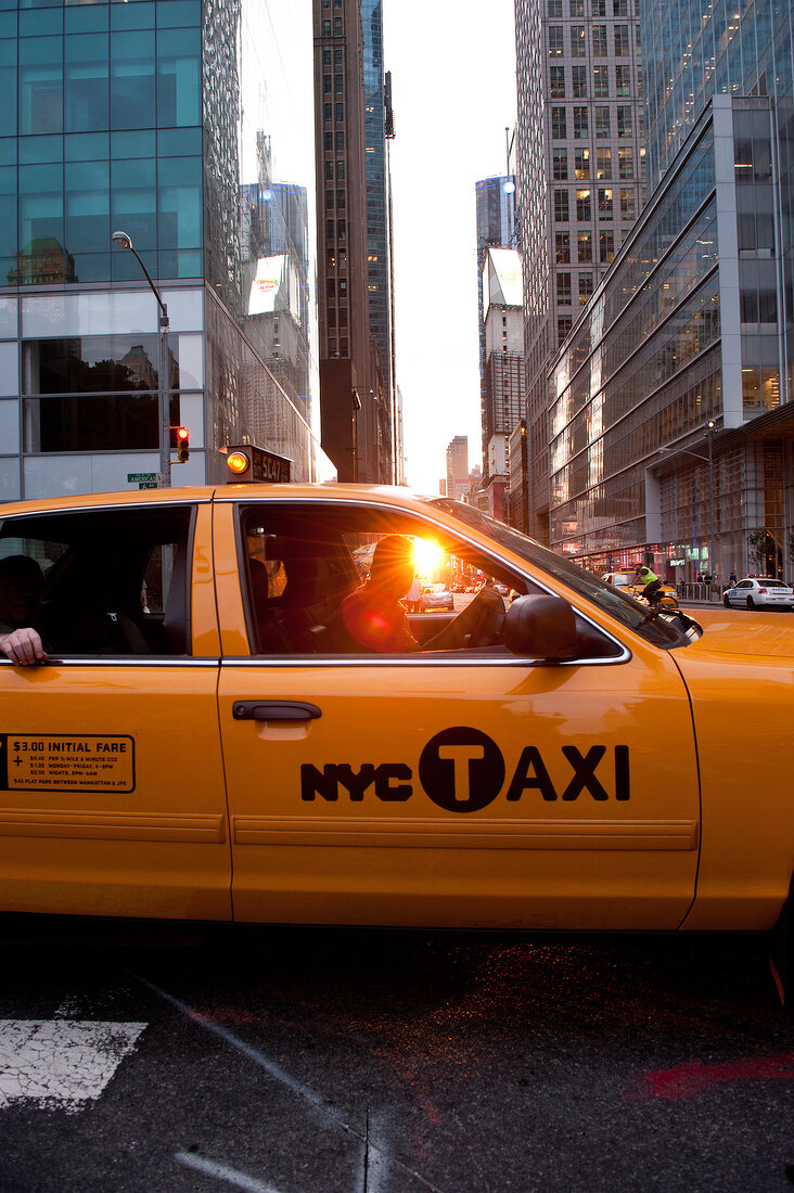 Taxi on road at Fifth Avenue, 42nd Street, New York, USA