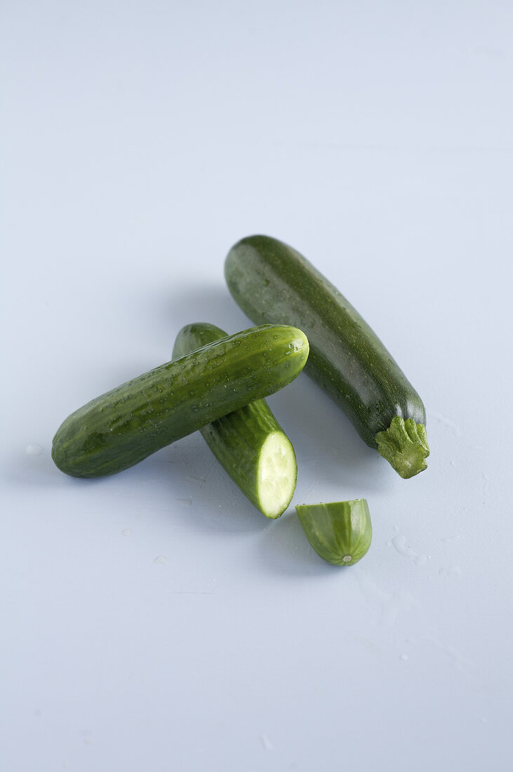 Zucchini and cucumber on white background