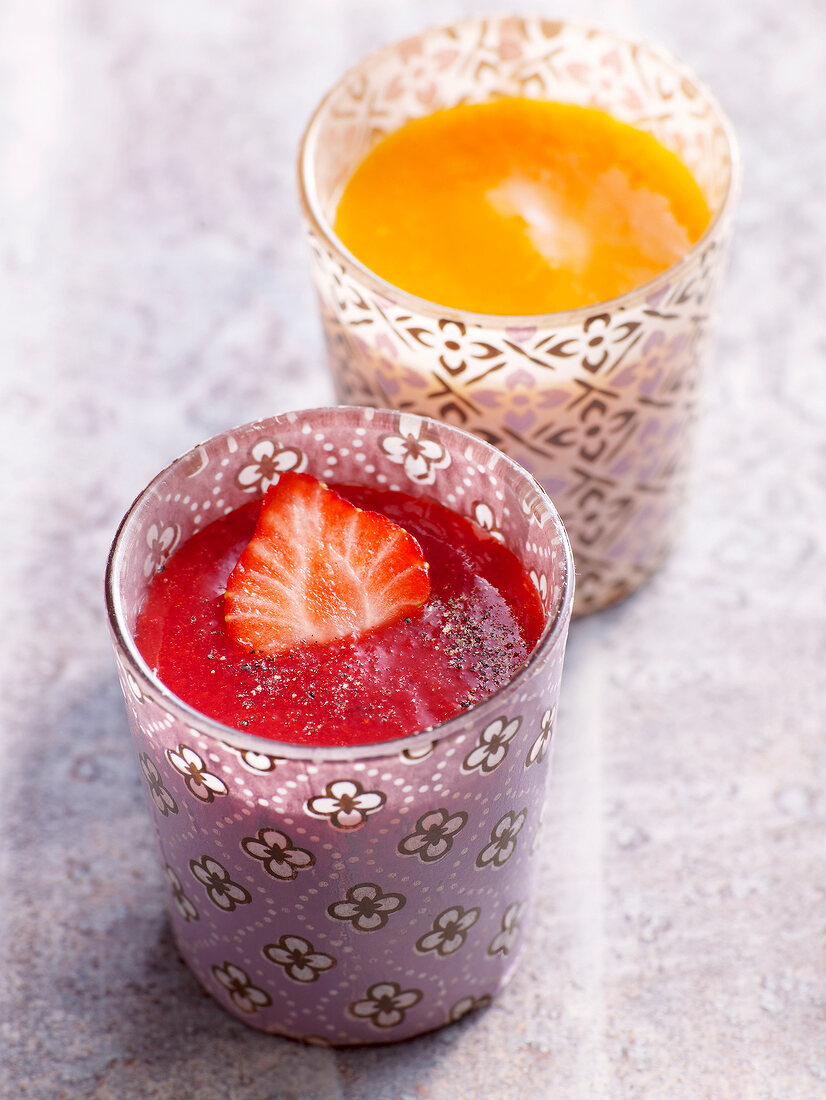Strawberry with pepper and mango with apricot sauce in glasses