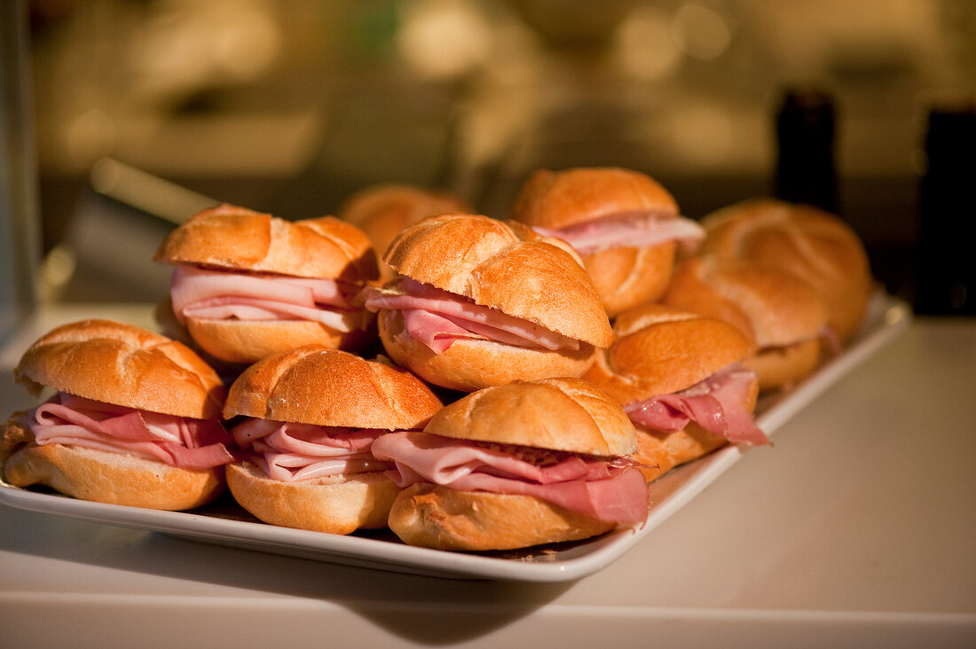 Sandwiches with ham on tray