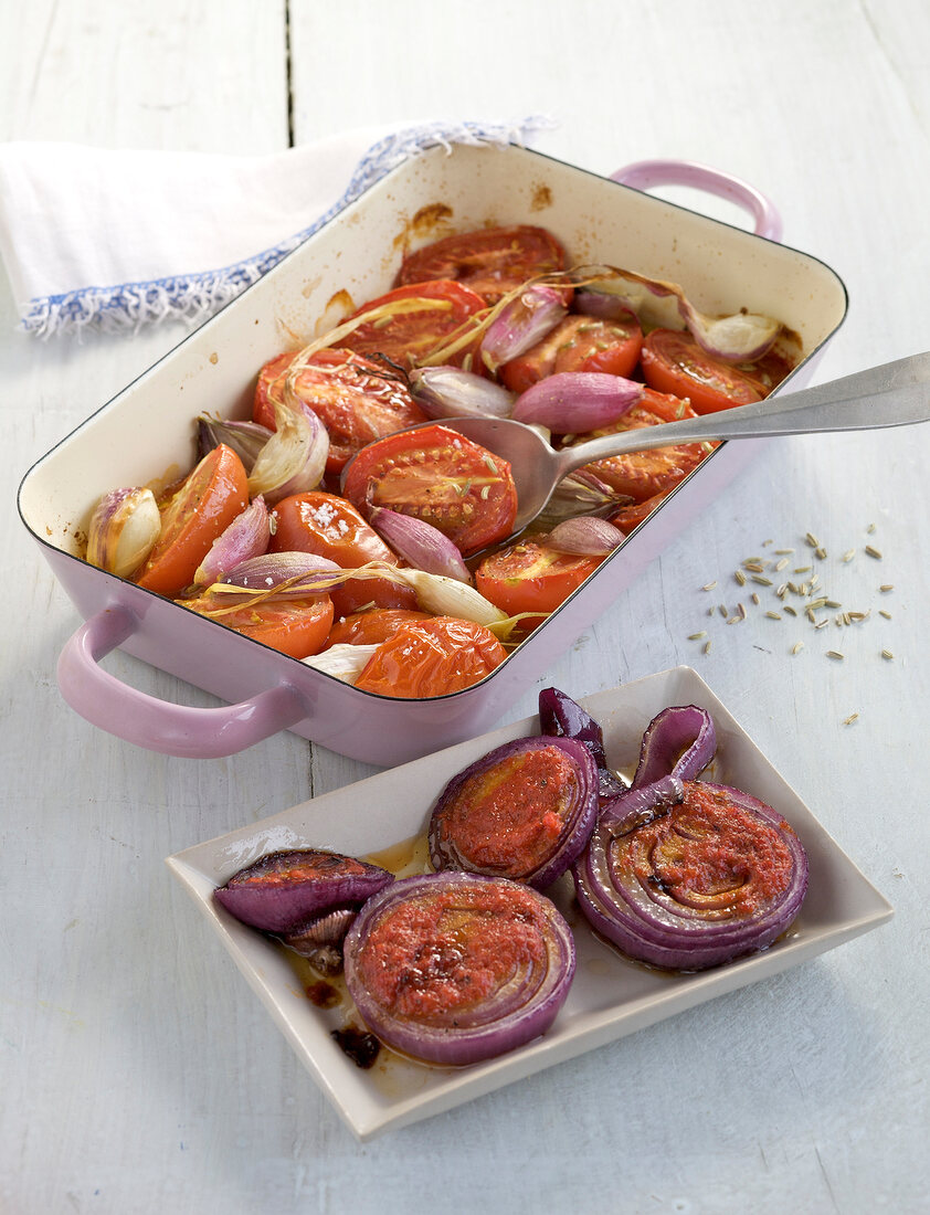Marinated tomatoes and onions in serving dish