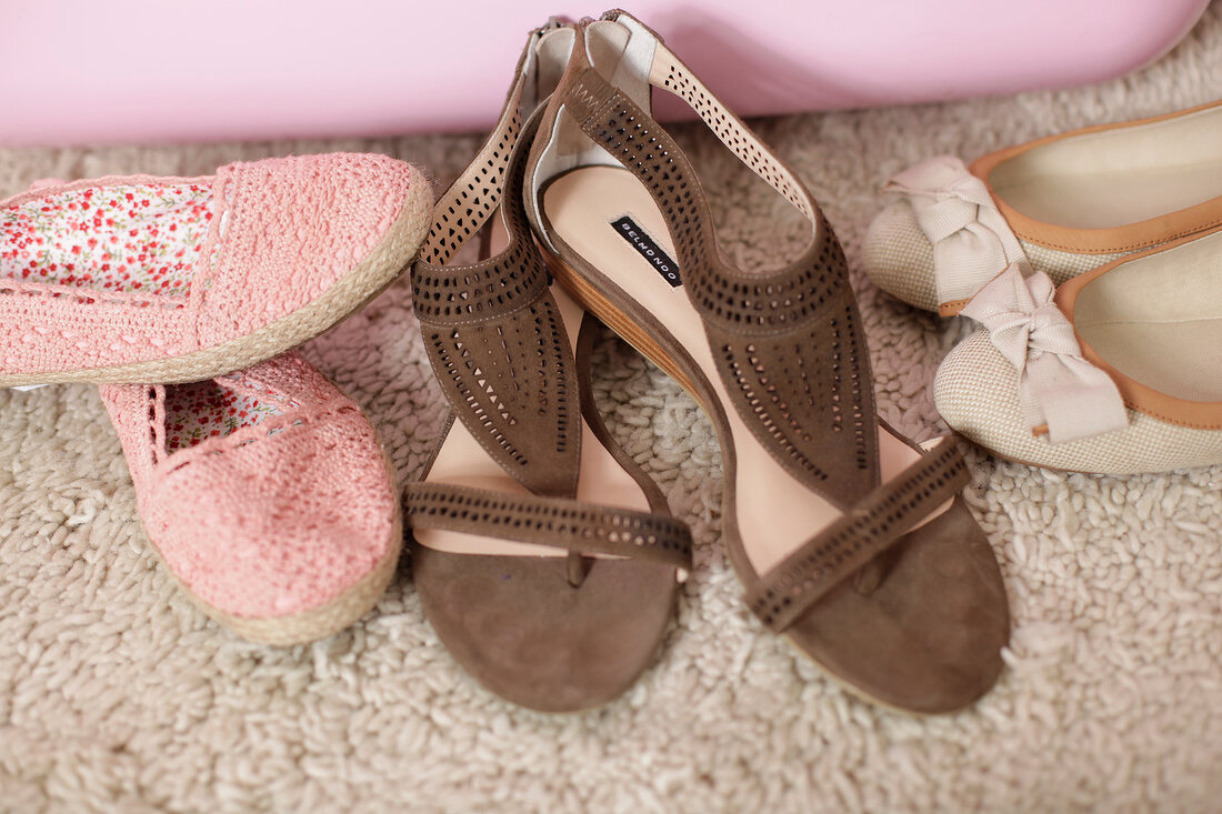Shoes, ballet flats and sandals on carpet