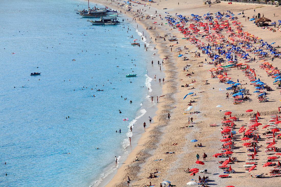 Tourist relaxing on beach in Oludeniz, Aegean, Turkey