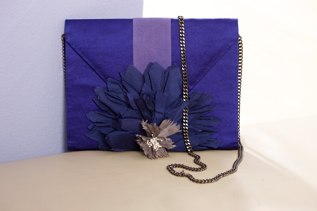Blue case bag with fabric flowers