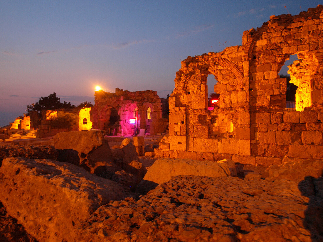 Ruined walls with evening lights at sunset