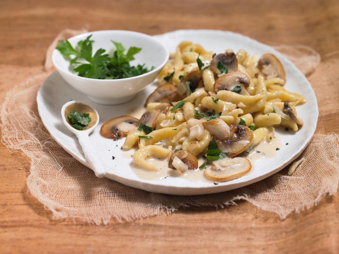 Spaetzle with mushroom cream on plate
