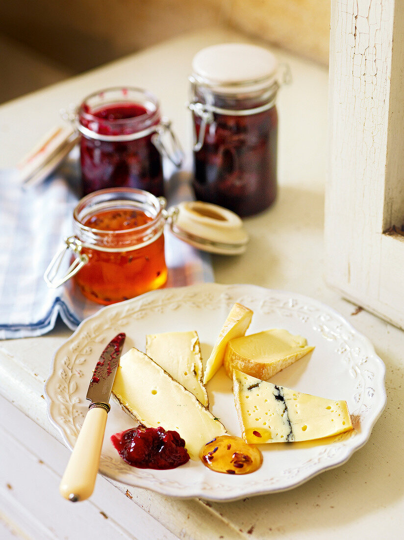 Soft cheese with sweet jam on plate, France
