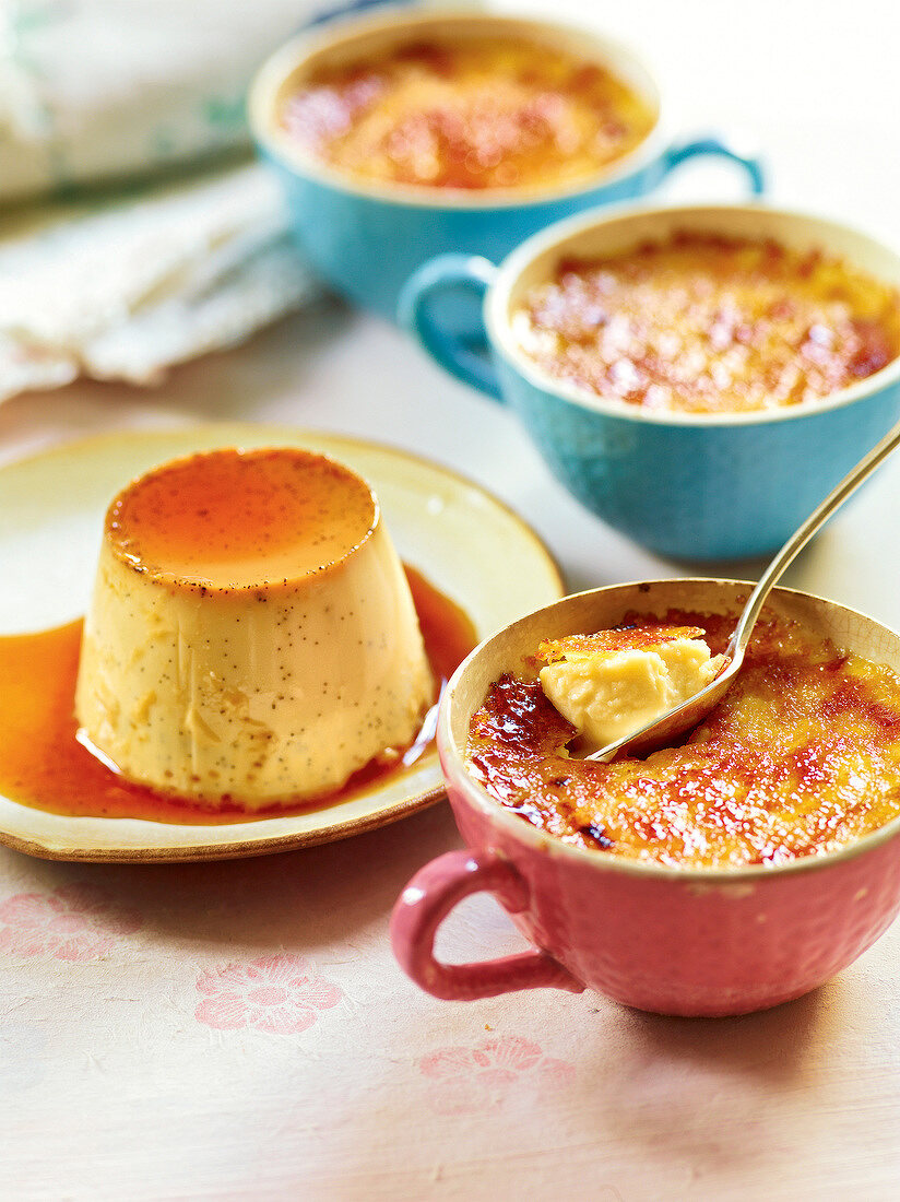 Creme caramel on plate and creme brulee in cup, France