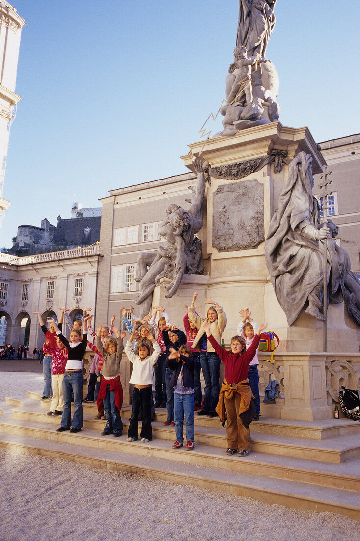 Children singing at Cathedral Square in front of St. Mary's School, Salzburg, Austria