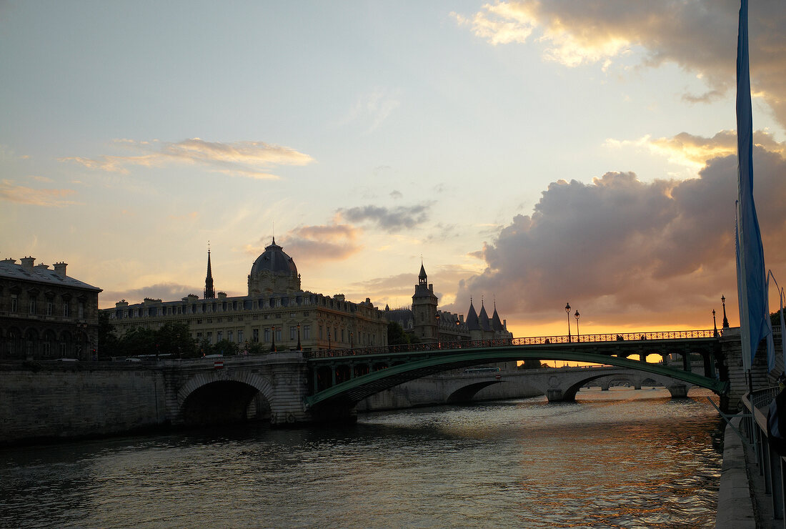 View of bridge on Seine River at sunset, Paris, France