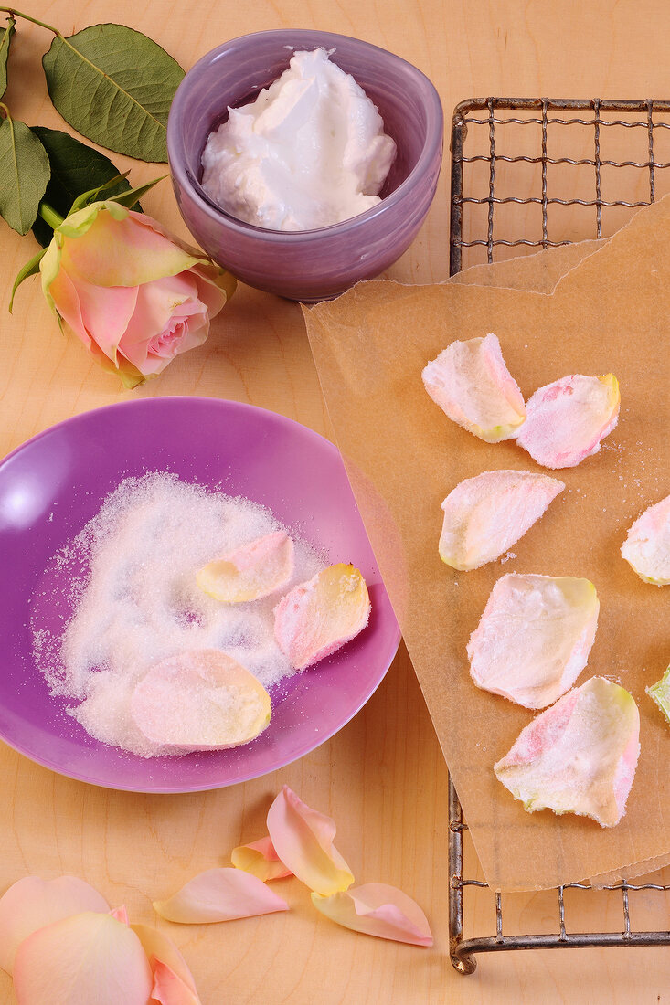 Rose petals with sugar and cream for preparation of desserts