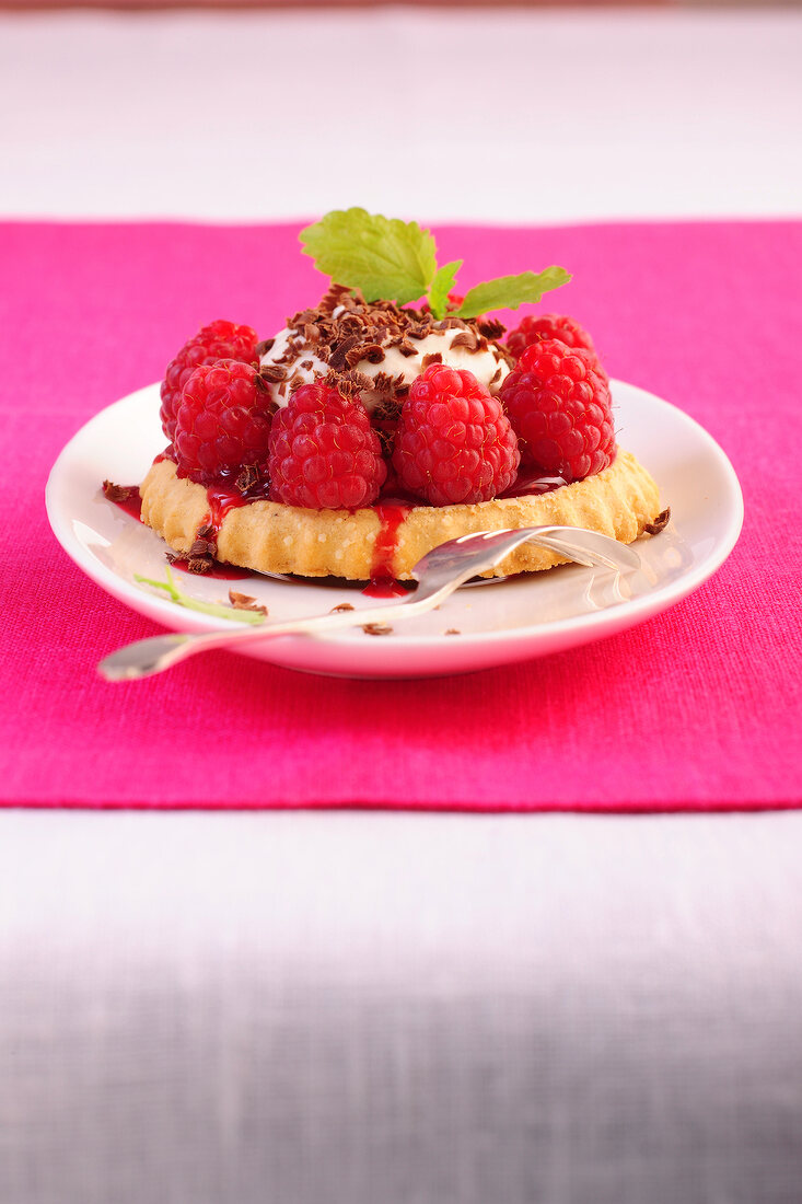 Raspberry tartlets on plate