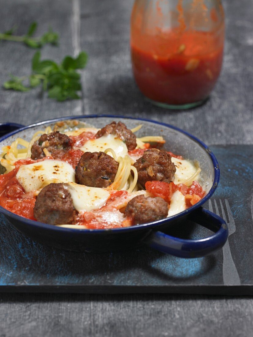 Spaghetti with meatballs, tomato sauce and mozzarella