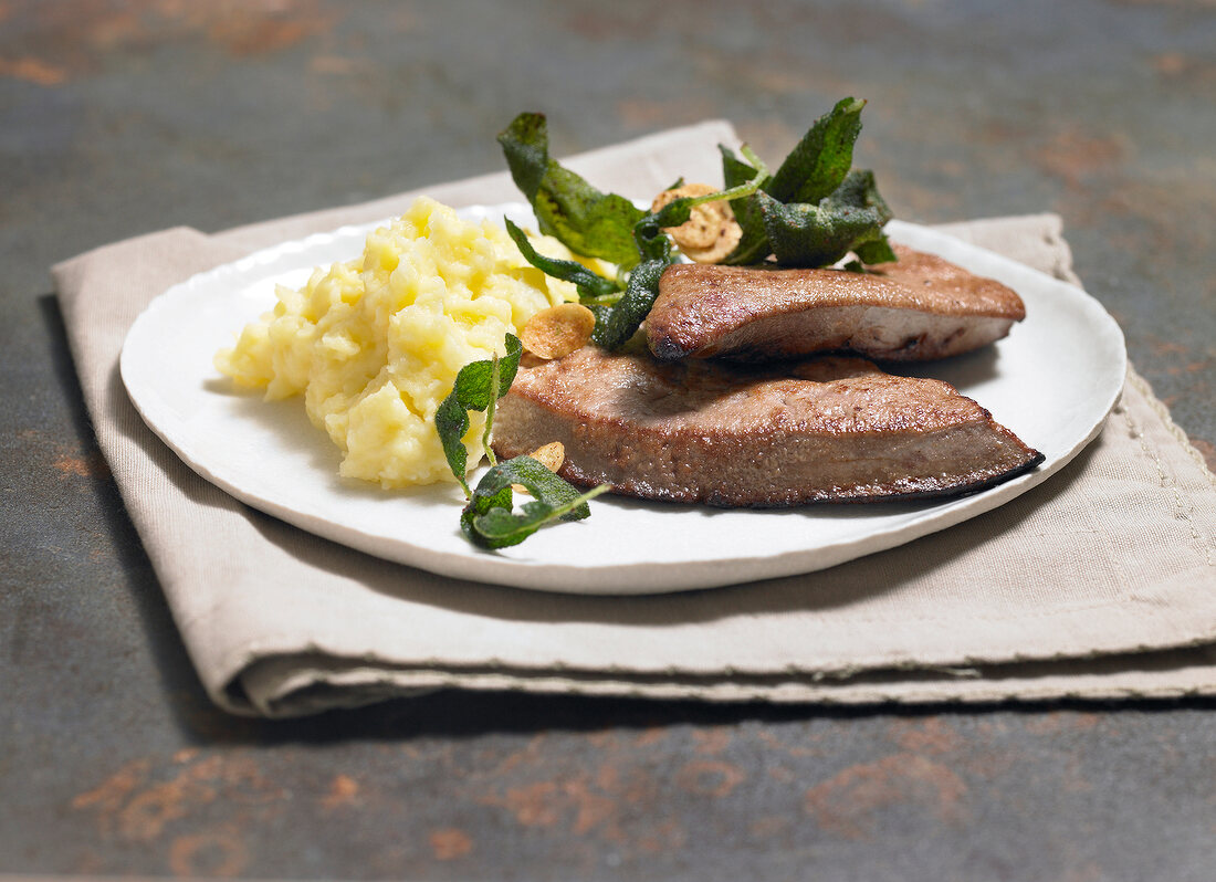 Calf liver in sage butter on plate