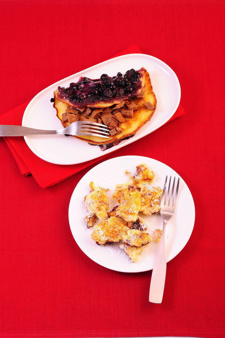 Blueberry praline pancakes and topfenschmarren on plates