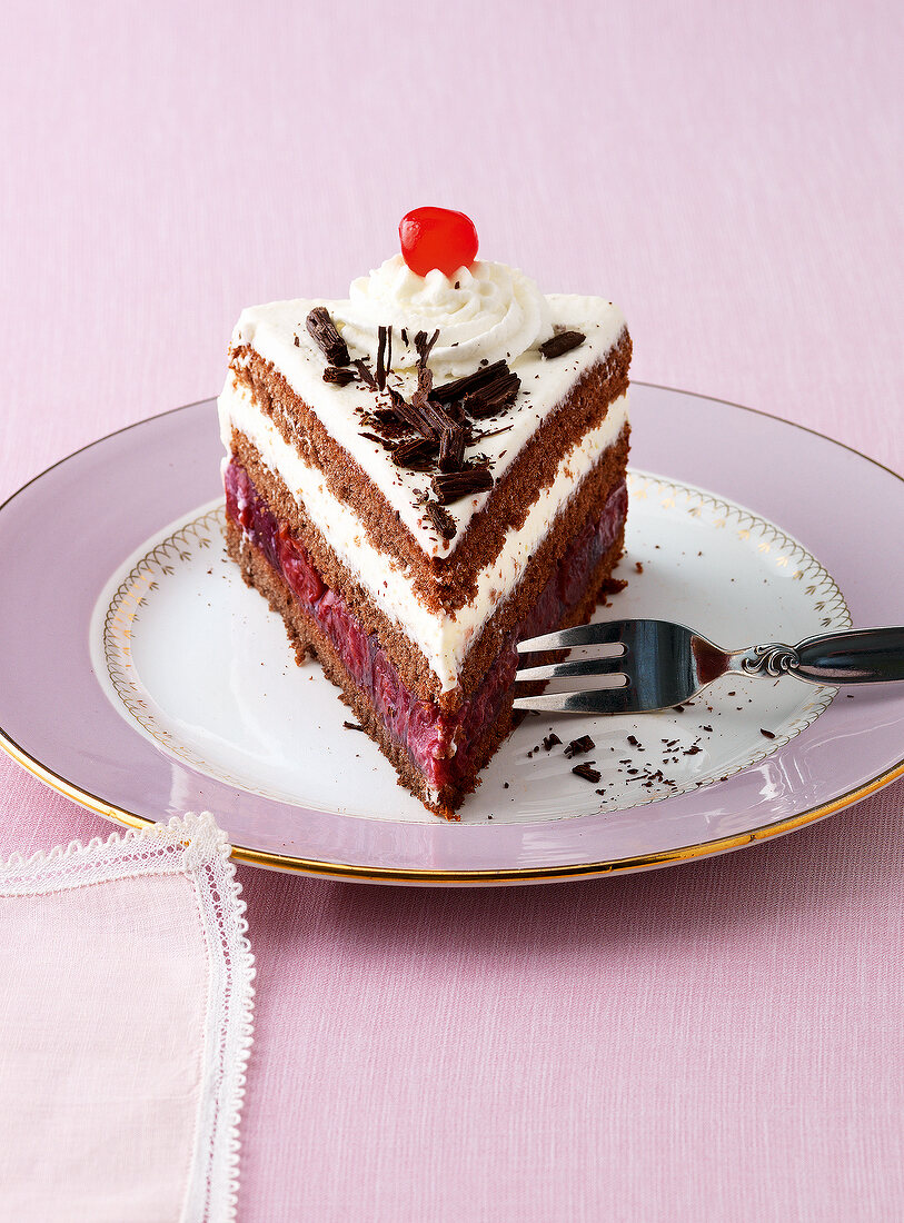 Piece of black forest gateau on plate