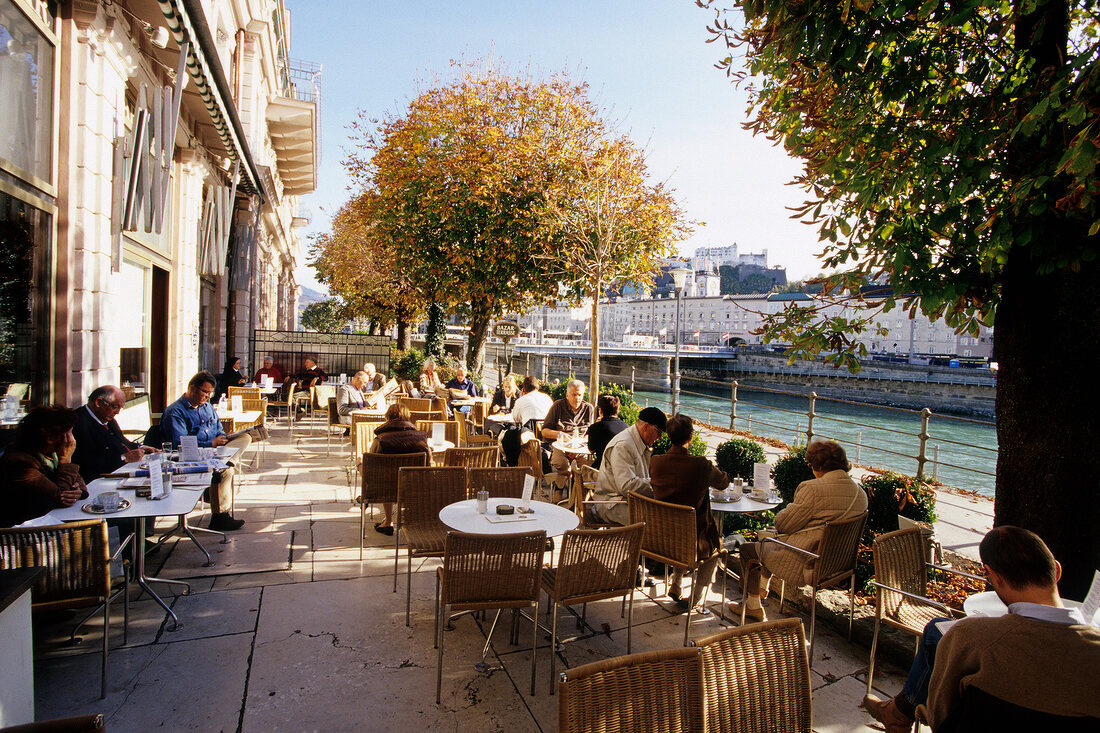 People at cafe Terrace at Bazar Elisabethufer, Salzburg, Austria