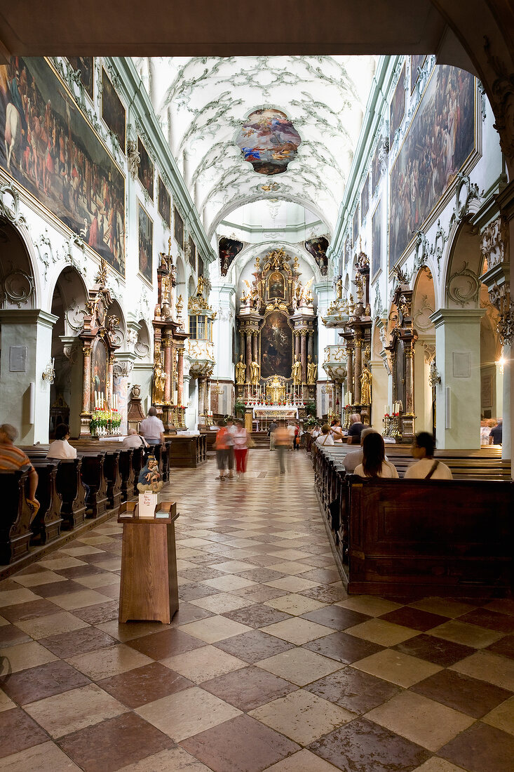 People inside St. Peter's Abbey at Salzburg, Austria, blurred motion