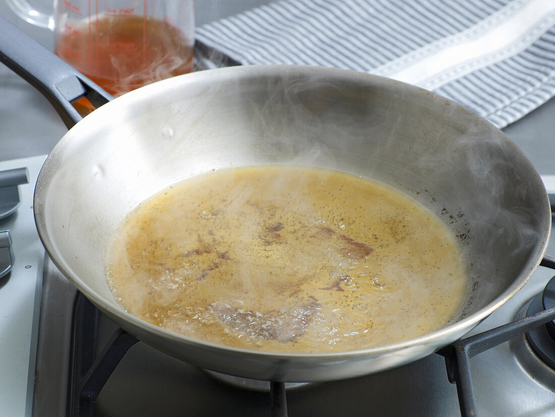 Pan drippings being boiled in frying pan, step 2