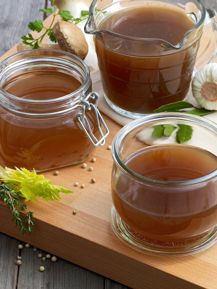 Lamb and wild mushroom sauces in glass containers